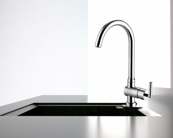water flows from the kitchen tap to black kitchen sink